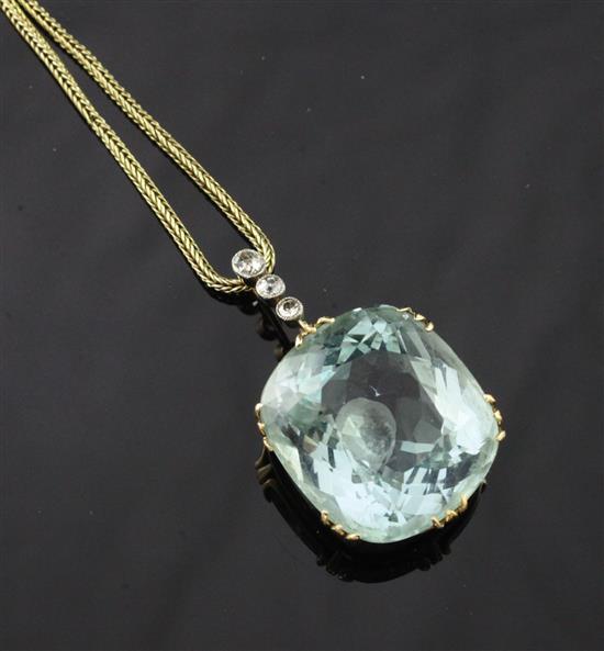 A gold mounted aquamarine and diamond set drop pendant, on a fine link gold chain, chain 16in.